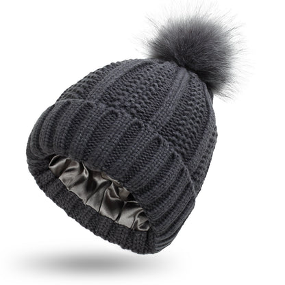 Fabulous Fur Fiesta: Stylish Stretchy Satin Hats with Skull Knit and Faux Fur Pom Pom for Women